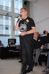 Wally Meehan leads the singing of 'You'll Never Walk Alone' in memory of Rob Olthof